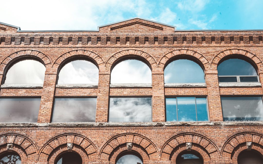 Upward view of a brick business building.